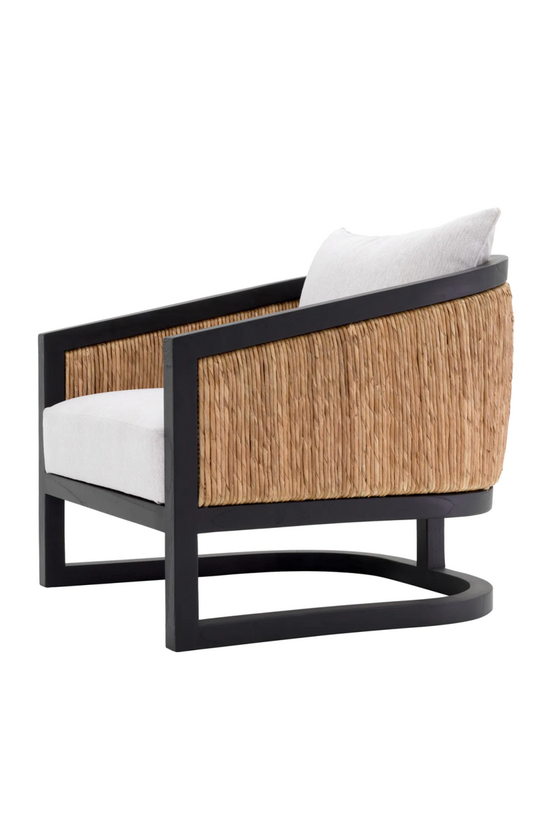 Fauteuil crème en bois noir et rotin | Eichholtz Aruba | Meubleluxe.fr