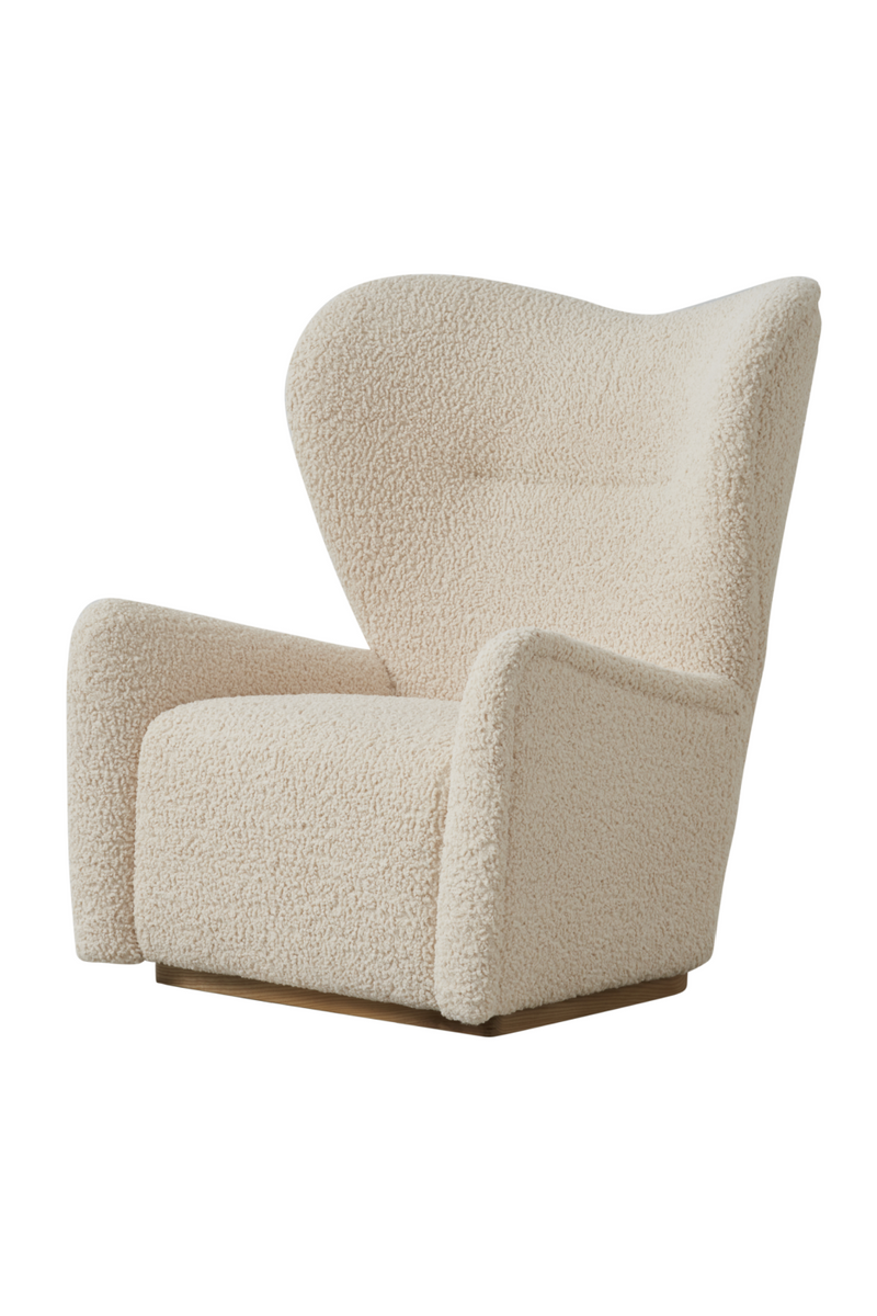 Fauteuil pivotant bouclé crème | Andrew Martin Sherpa | Meubleluxe.fr