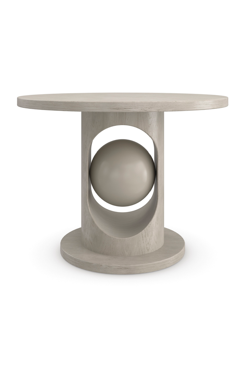 Table de salle à manger ronde en bois chêne taupe | Caracole Pearl | Meubleluxe.fr