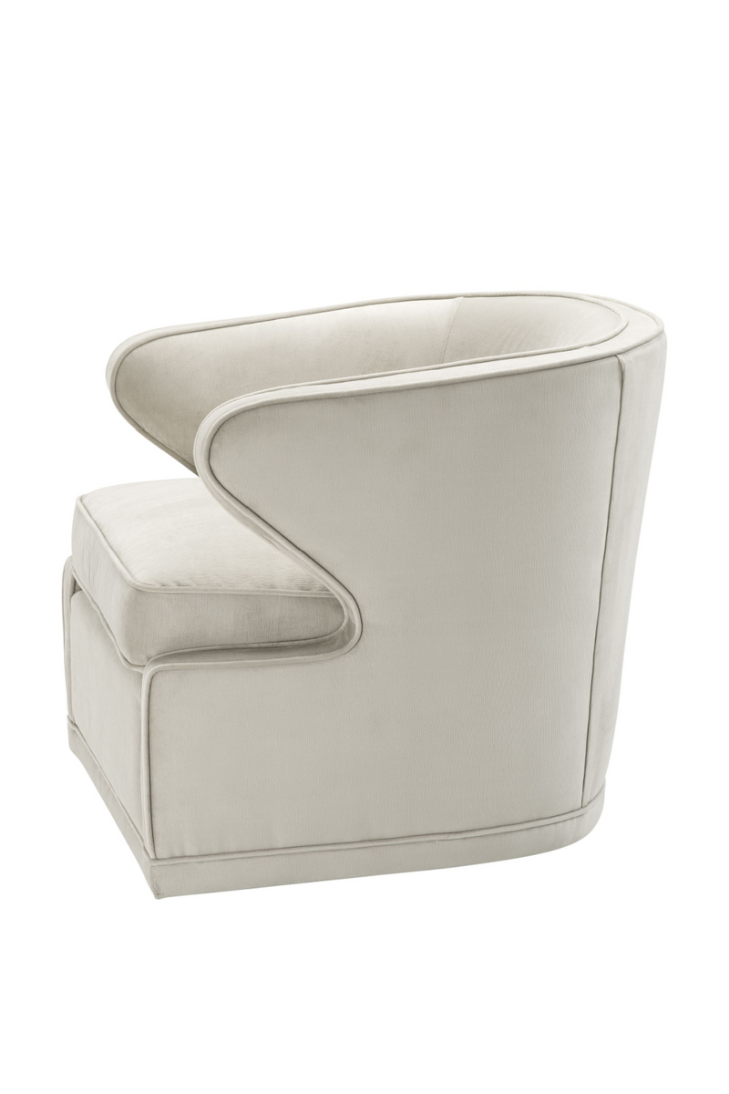 Fauteuil pivotant en velours beige | Eichholtz Dorset | Meubleluxe.fr