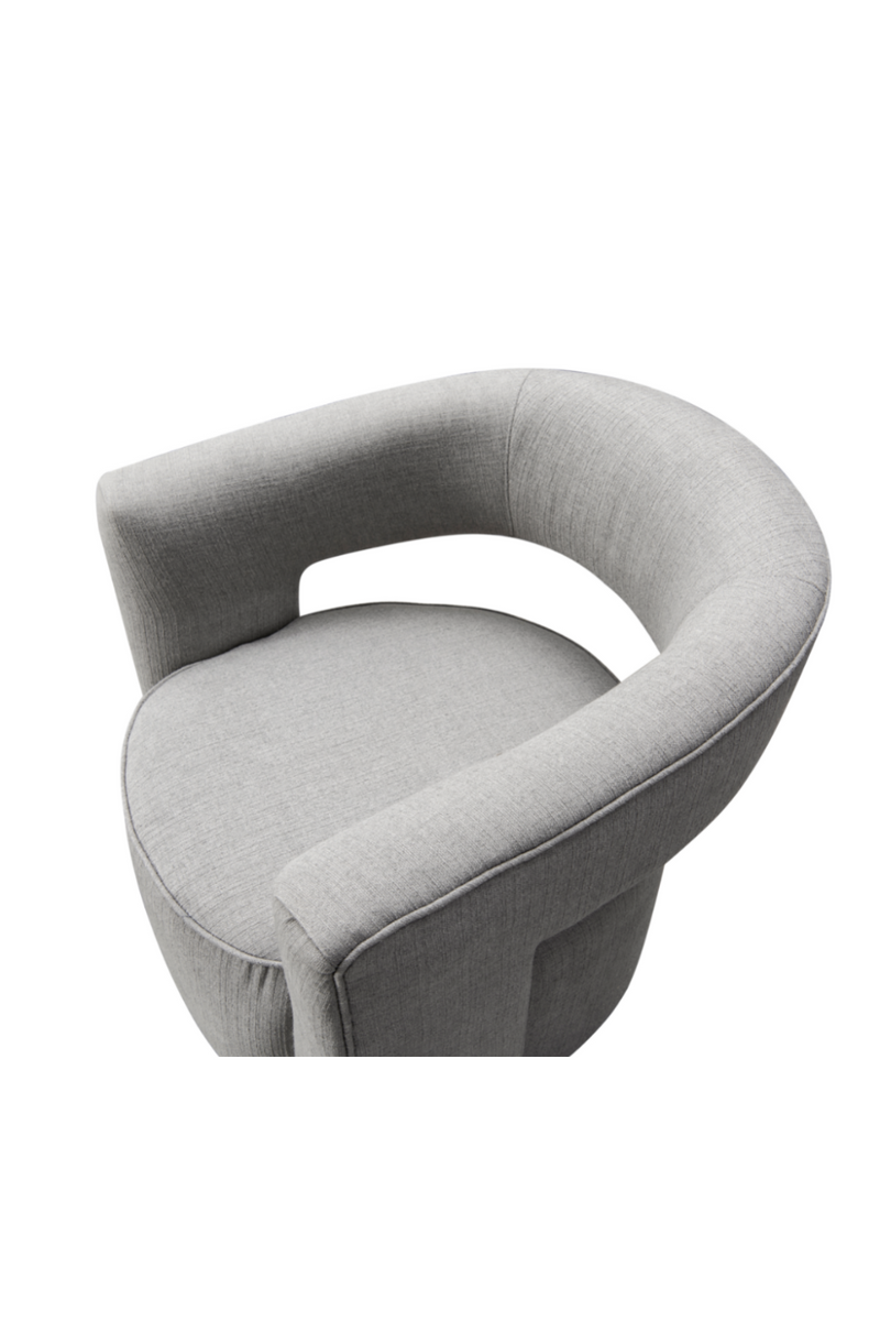 Fauteuil pivotant en tissu gris | Andrew Martin Madison | Meubleluxe.fr