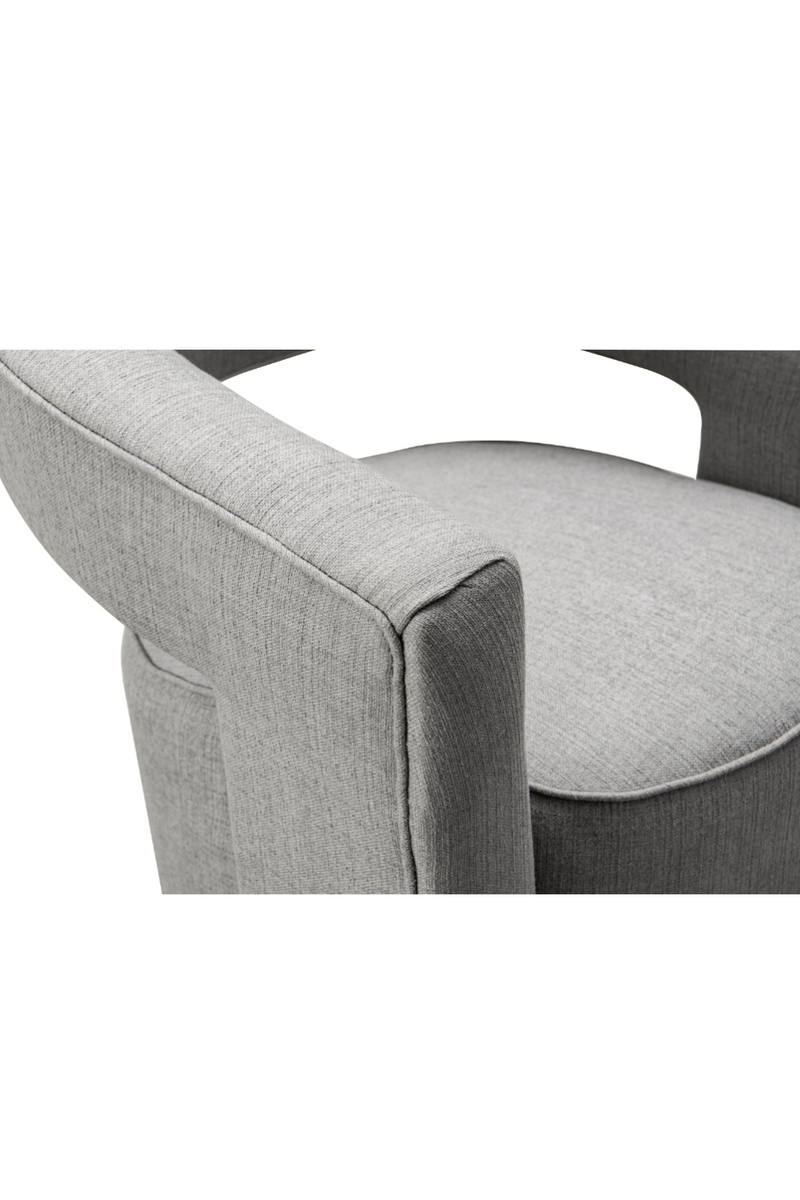 Fauteuil pivotant en tissu gris | Andrew Martin Madison | Meubleluxe.fr