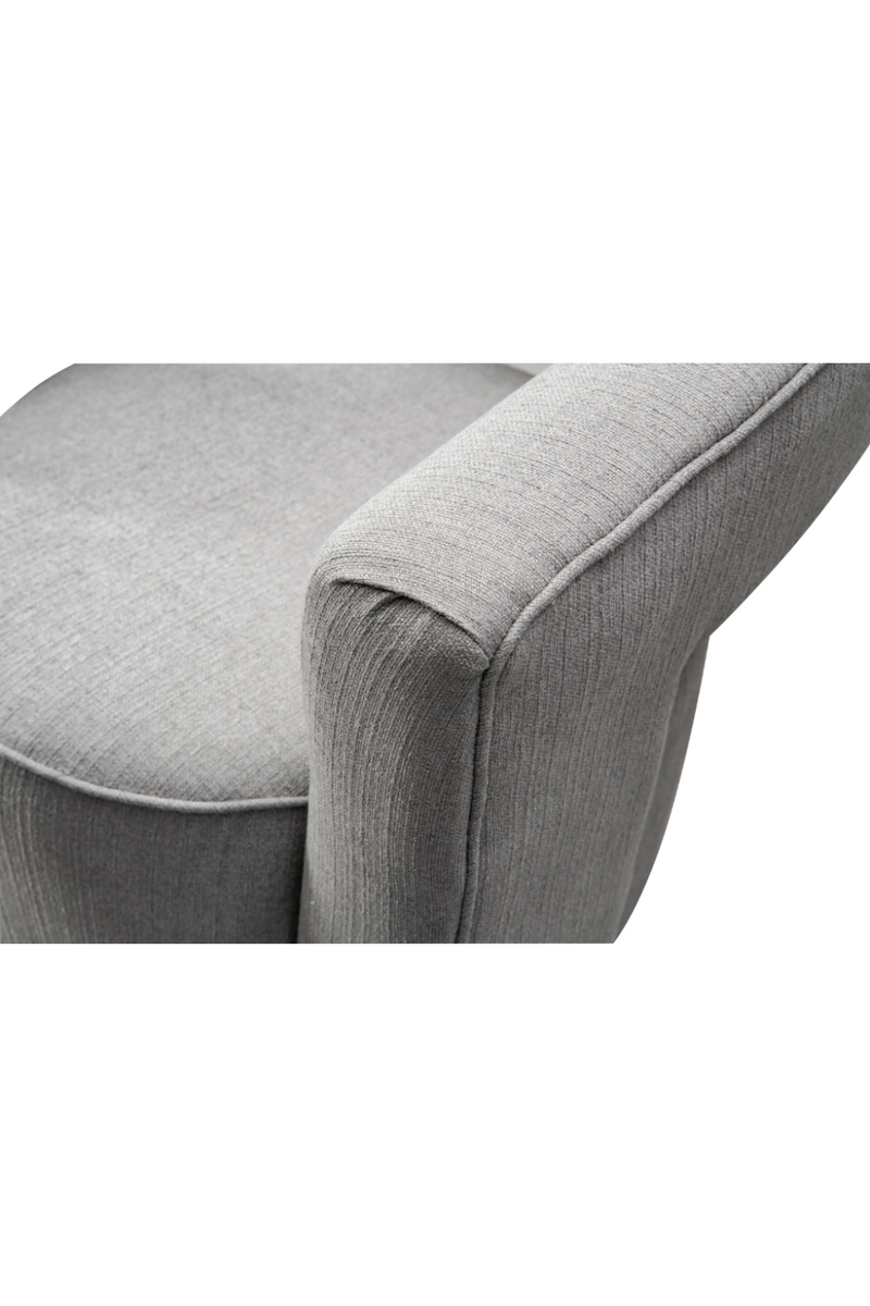 Fauteuil pivotant en tissu gris | Andrew Martin Madison | Meubleluxe.fr